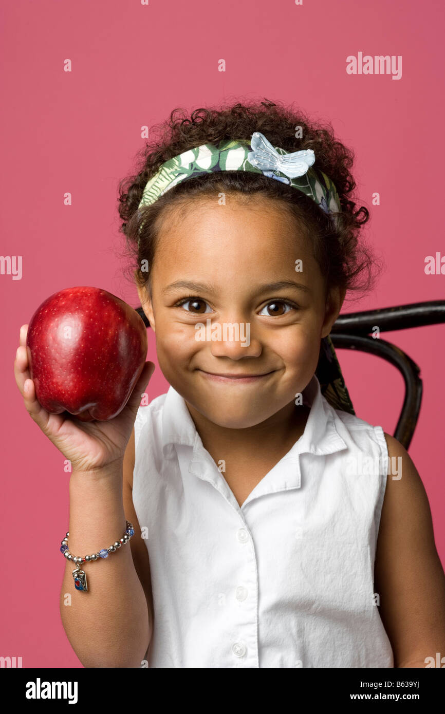 Portrait Of A Little African American Girl Sitting In A Chair