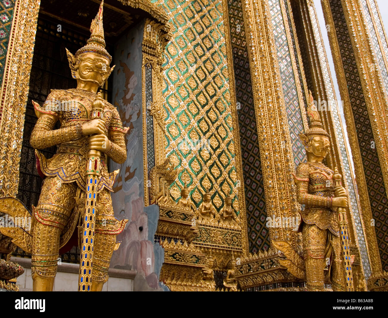 golden guardian statues at the Golden Palace in Bangkok Thailand Stock ...
