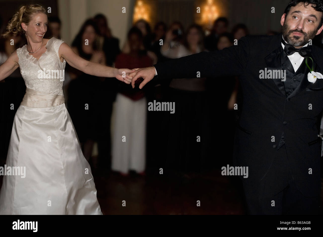 Mid adult woman dancing with a mature man Stock Photo