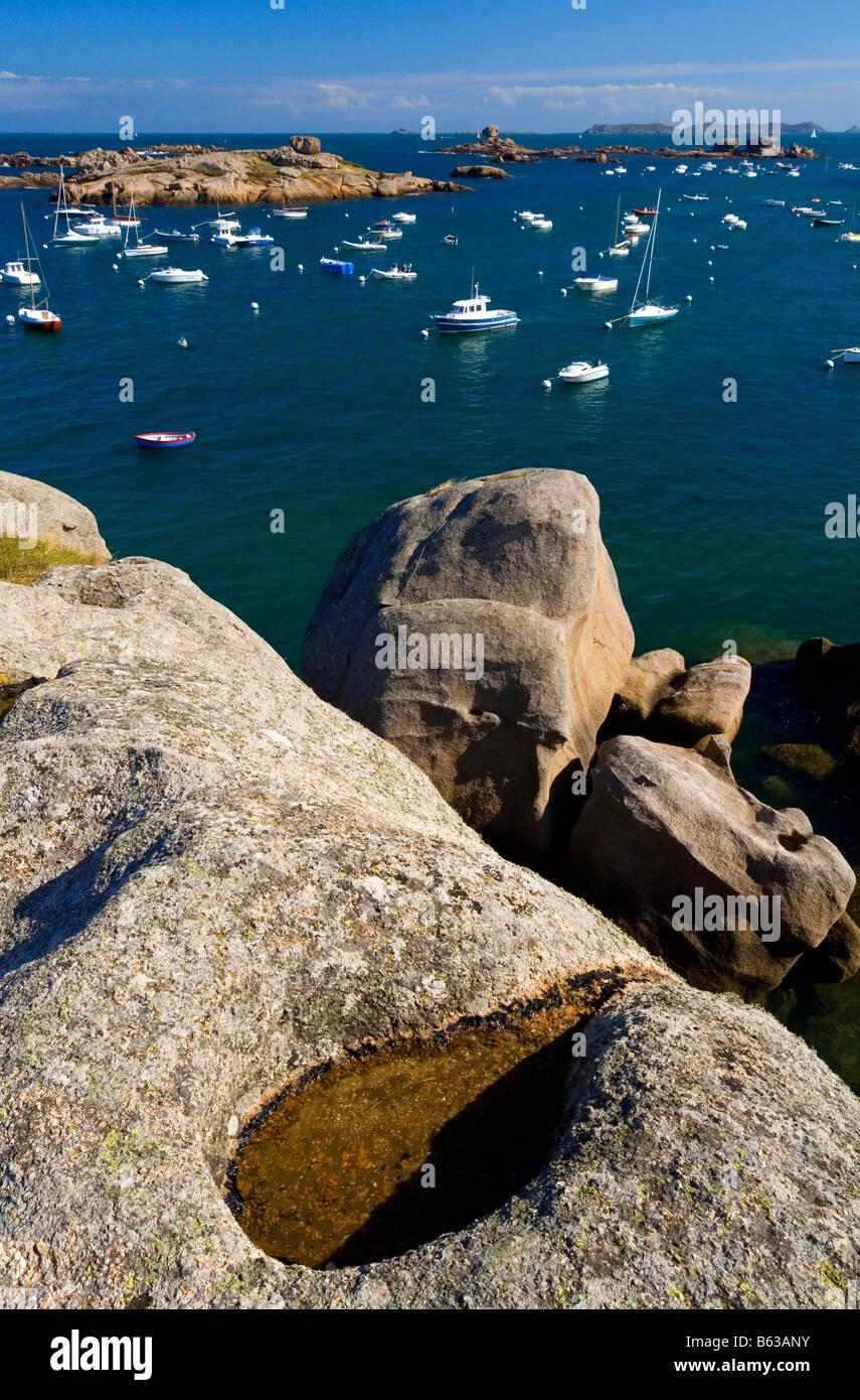 Rocks on beach at Tregastel on the Cote de Granite Rose or Pink Granite ...