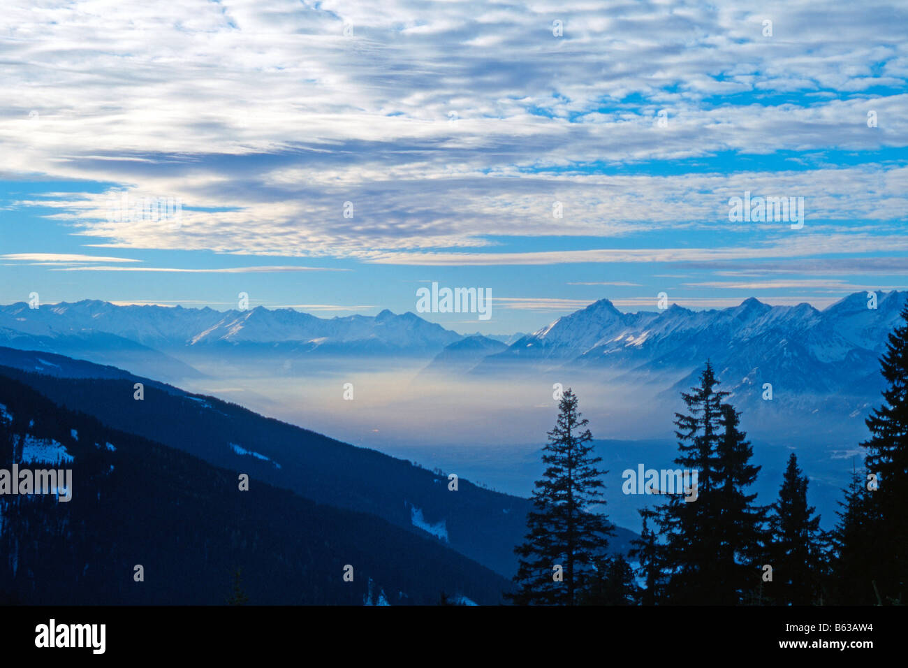Atmospheric inversion in the valley of the river Inn between the cities Wattens and Innsbruck Stock Photo