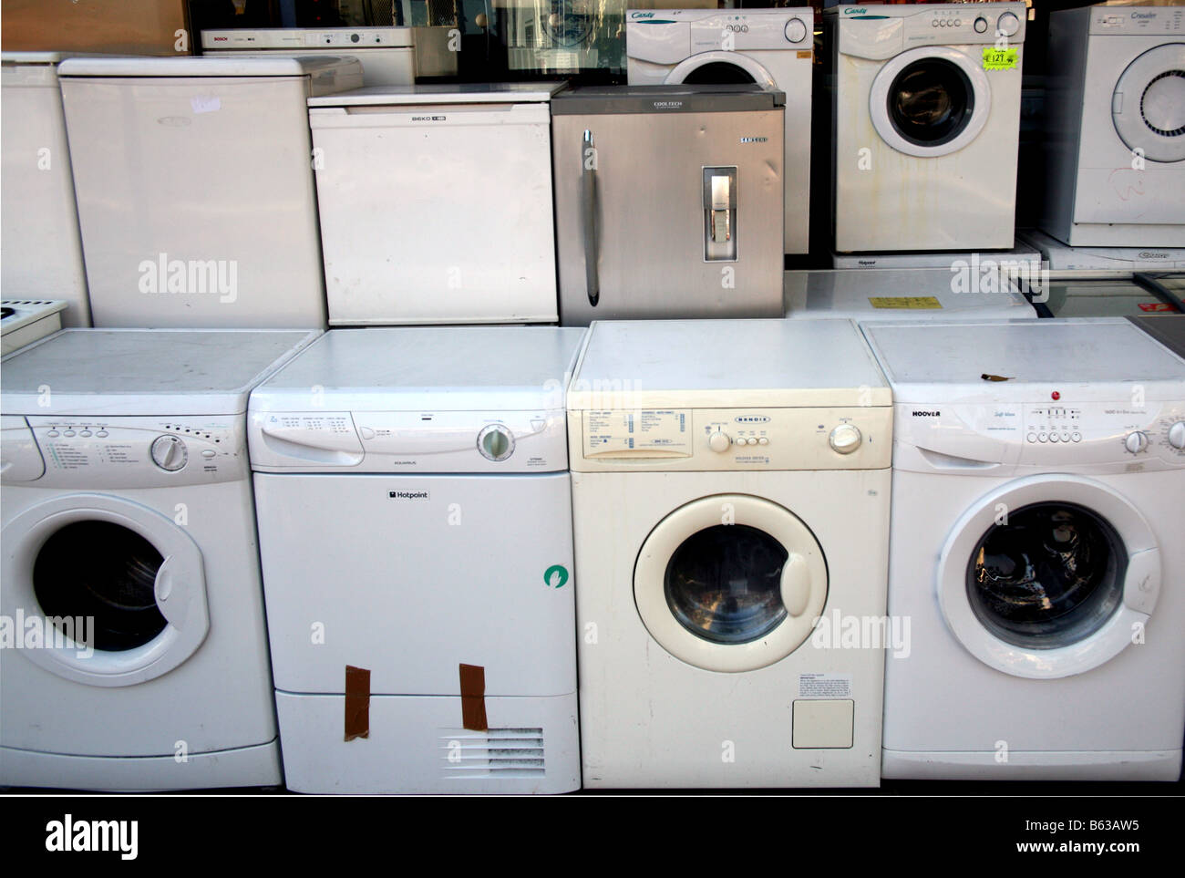 Secondhand washing machines & fridges on sale outside London shop Stock Photo