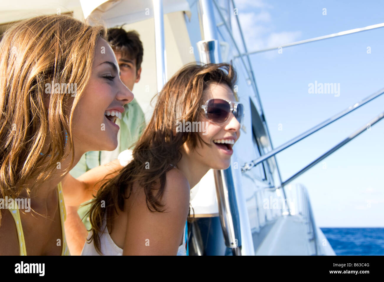 Close-up of two young women smiling Stock Photo - Alamy