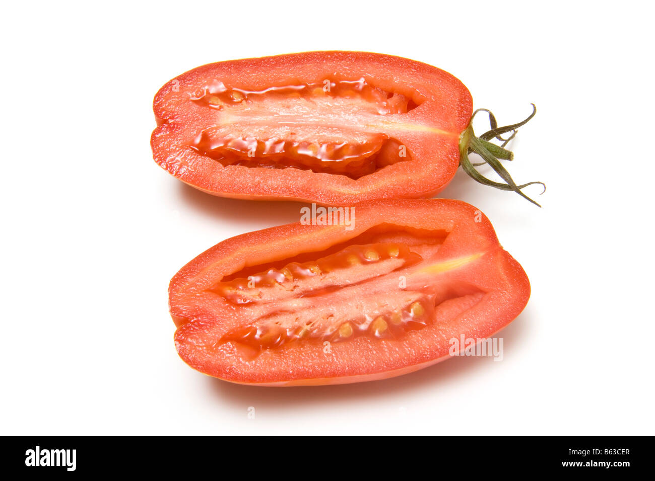Plum tomatoes isolated on a white studio background Stock Photo - Alamy