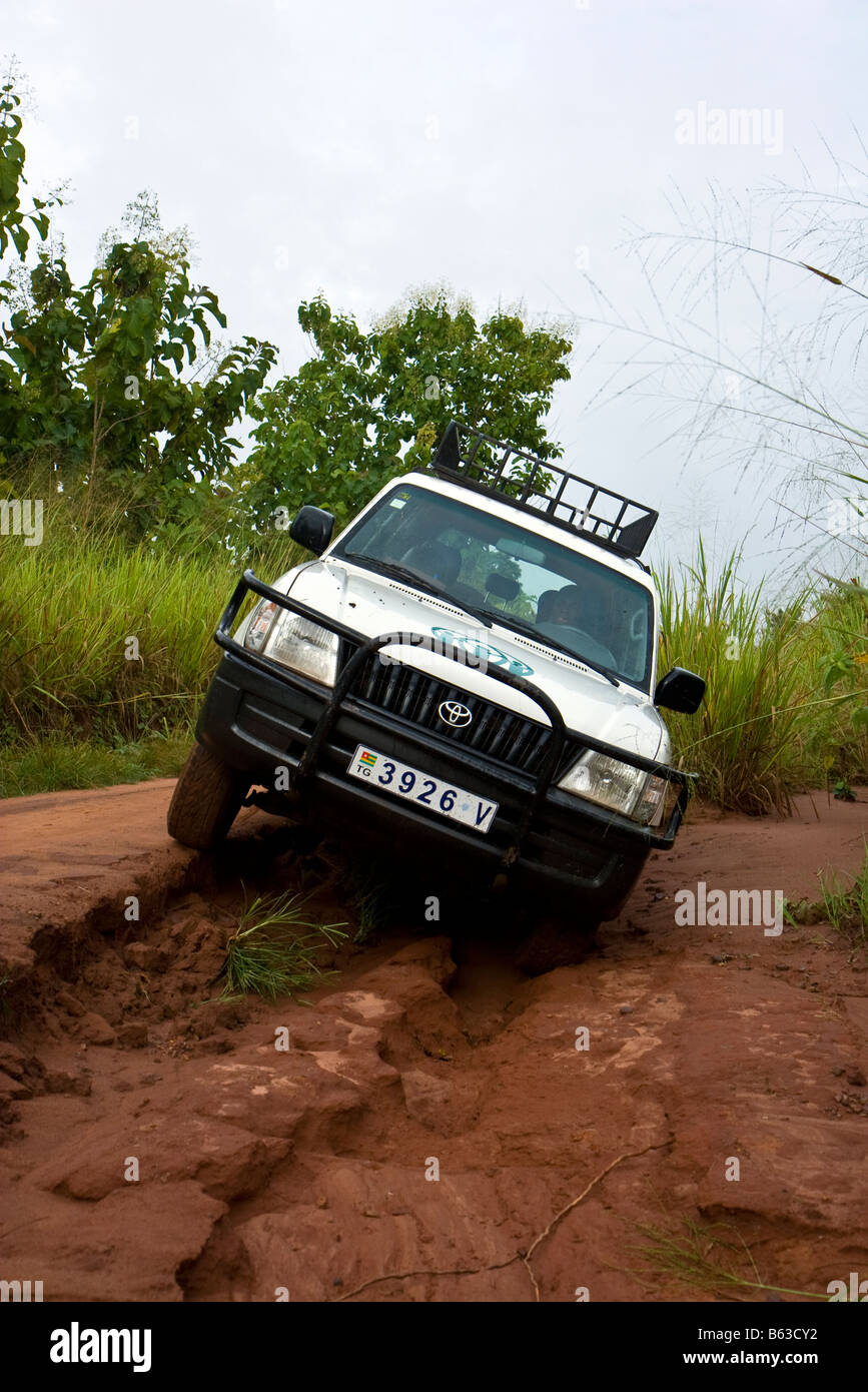 A humanitarian aid organization in Africa travels the dirt roads en route to a project visit. Stock Photo