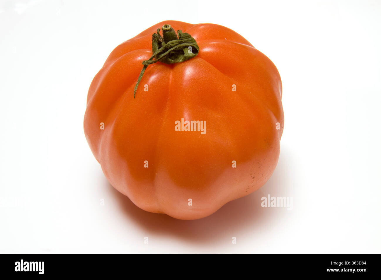 Beef tomato isolated on a white studio background Stock Photo - Alamy