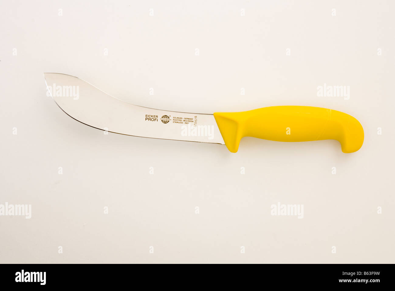 yellow handled butchers or chefs skinning knife on white background