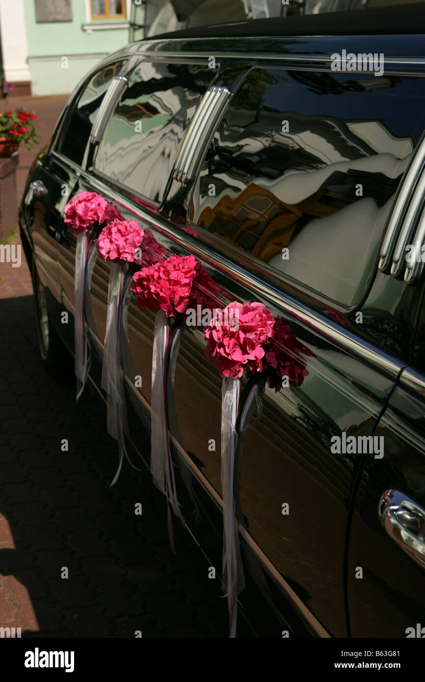 Side of decorated Black wedding car limousine Stock Photo