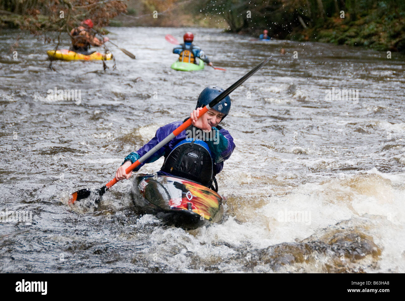People kayaking on the river Dart in Devon UK Stock Photo
