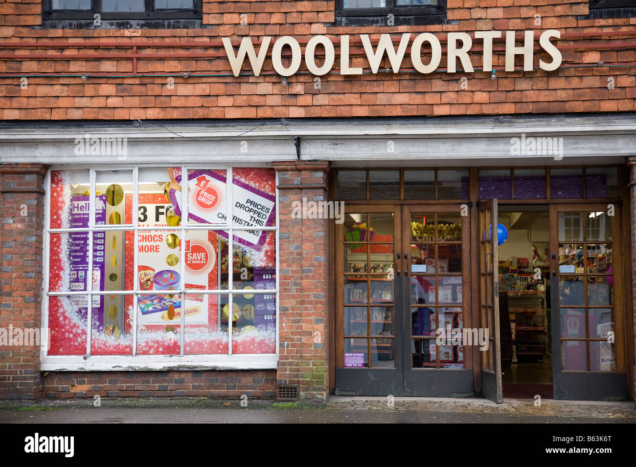 A Woolworths shop front with rare gold coloured signage, Haslemere, Surrey, England. Stock Photo