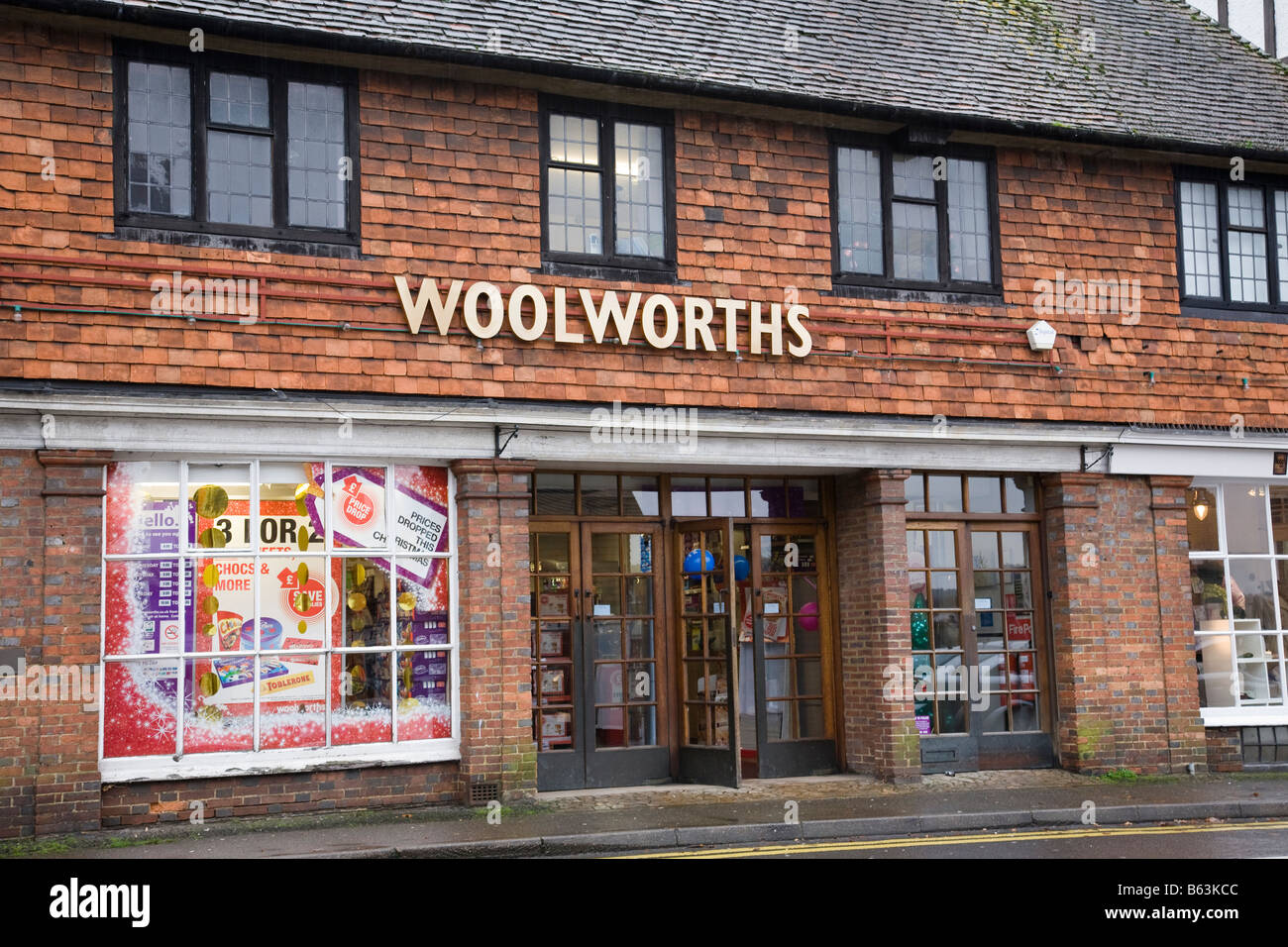 A Woolworths shop front with rare gold coloured signage, Haslemere, Surrey, England. Stock Photo