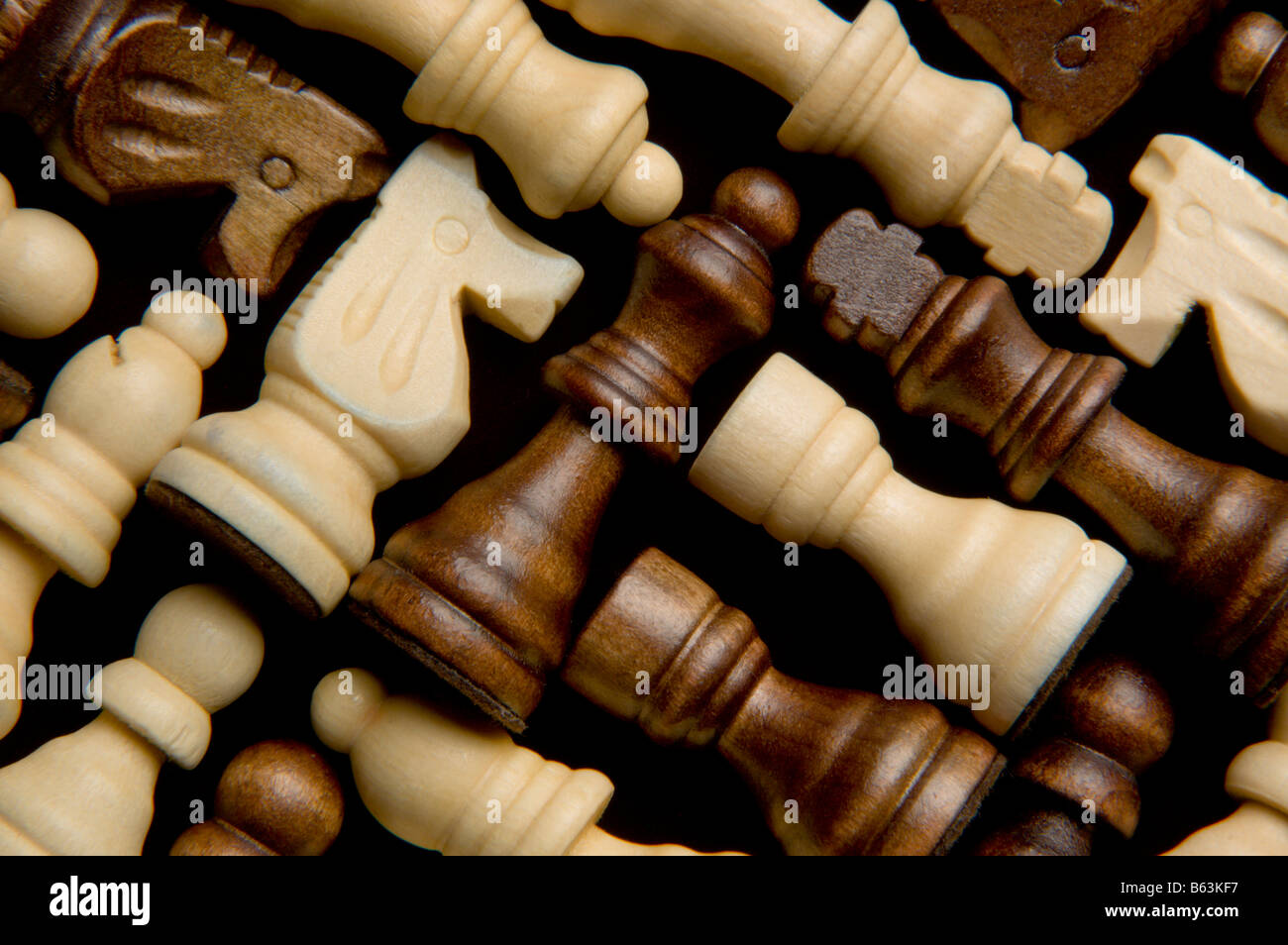 Chess pieces laid down in a group Stock Photo