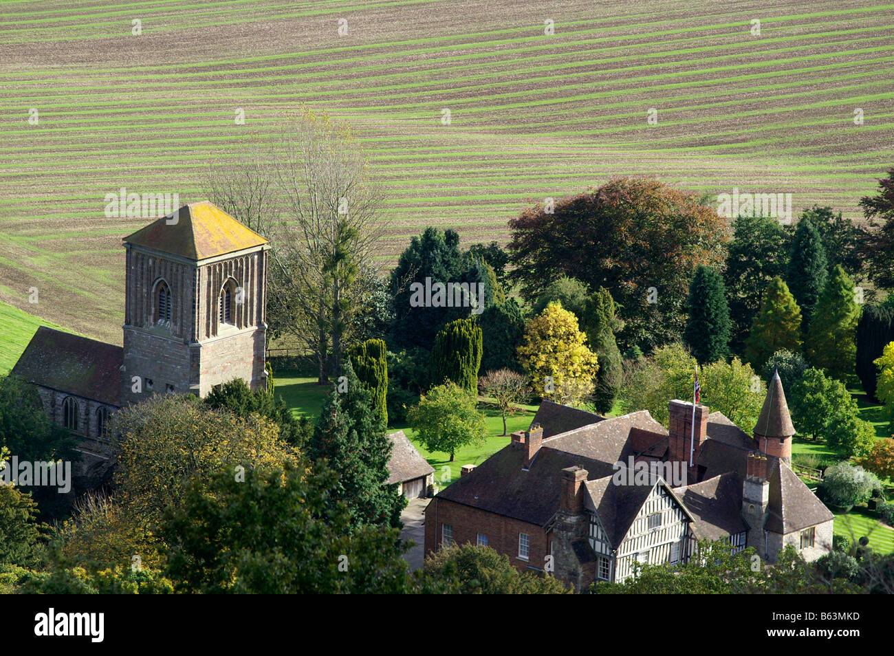 Church and manor house Little Malvern viewed from main ridge of the Malvern Hills Worcestershire England Stock Photo