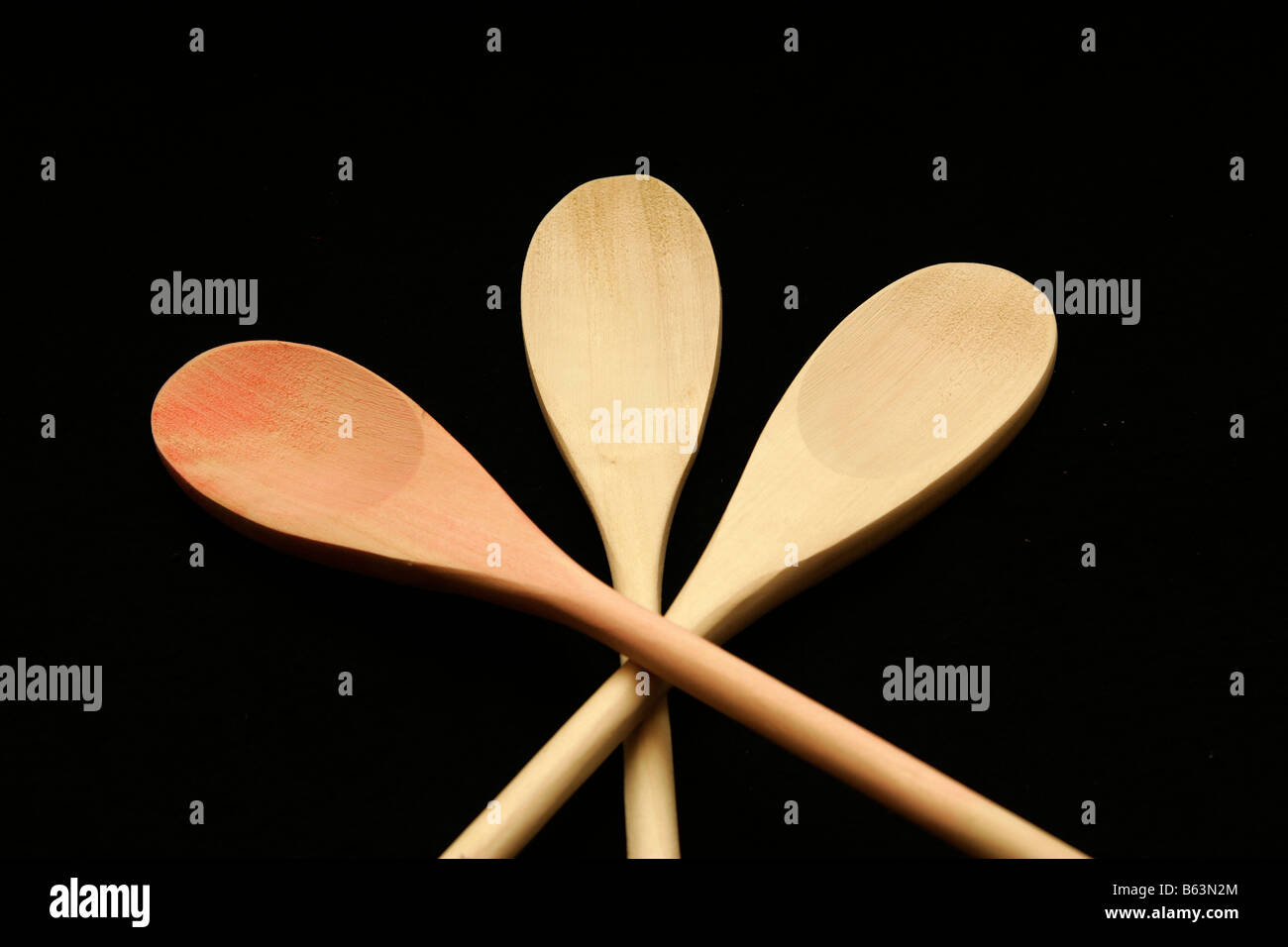 Three wooden spoons crossed Stock Photo Alamy