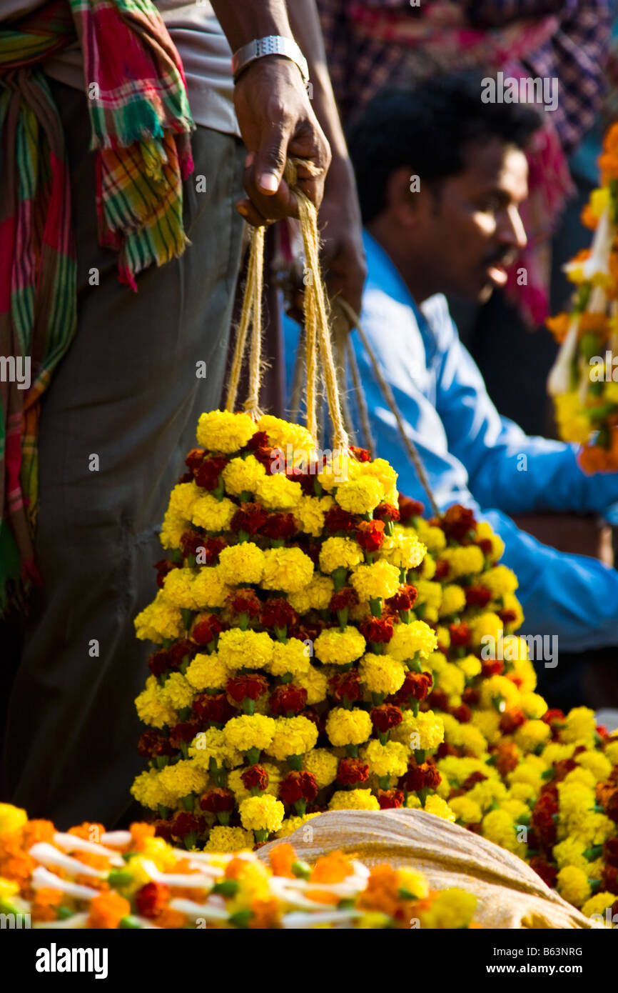 Traders sell ceremonial flowers at the Kolkata Flower Market West Bengal India Stock Photo