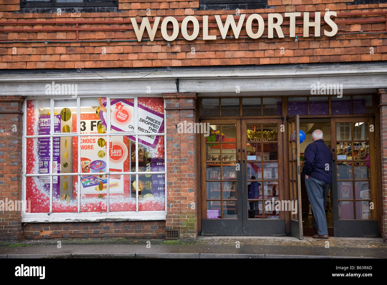 A Woolworths shop front with rare gold coloured signage, Haslemere, Surrey, England. Stock Photo