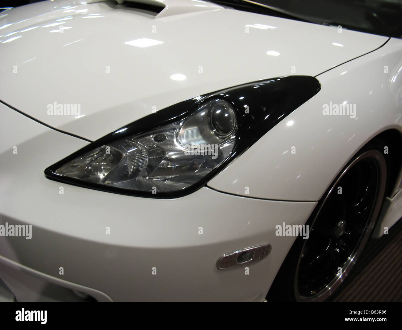 a detail shot of a sports car headlight Stock Photo