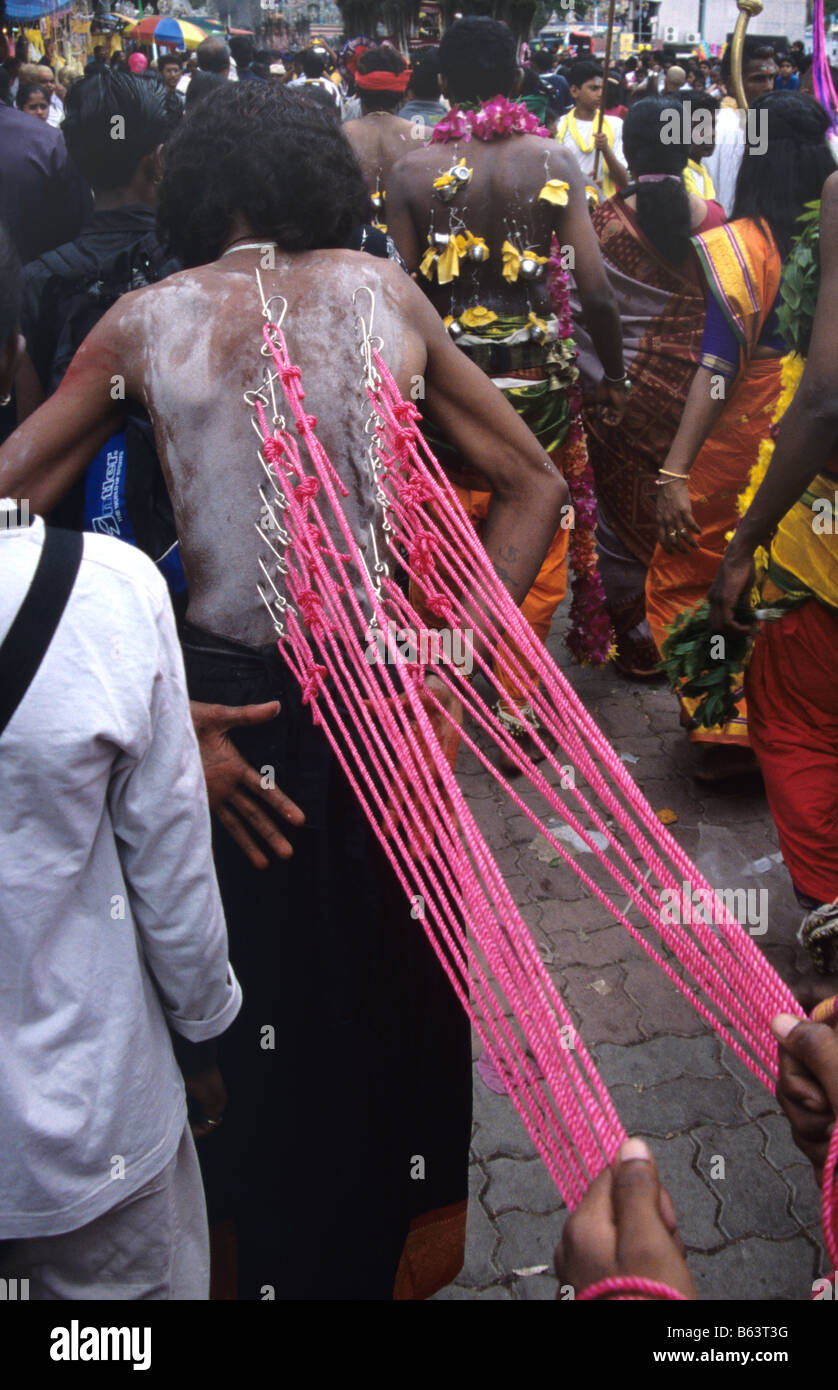 A Hindu penitent with pierced back during the annual Thaipusam Festival at Batu Caves, Kuala Lumpur, Malaysia Stock Photo