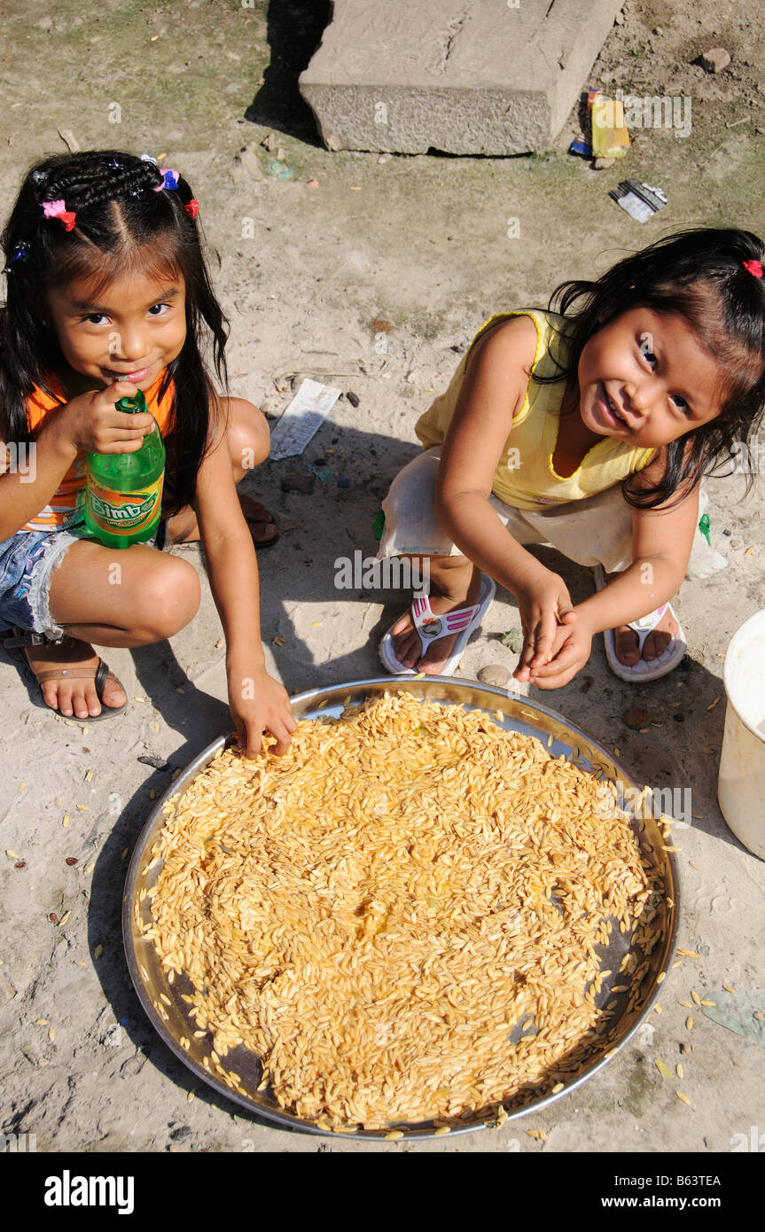 Two girls play in the district of Belen in Iquitos, Peru. Stock Photo