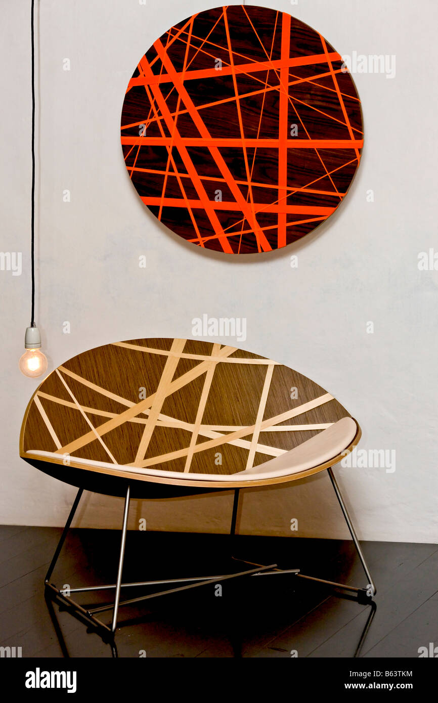 Modern designer chair and wall art Stock Photo