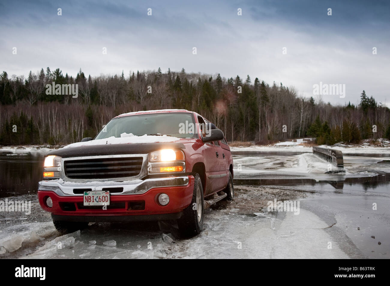 Grouse Hunting and truck driving in New Brunswick late fall early winter with snow cover in canada Stock Photo