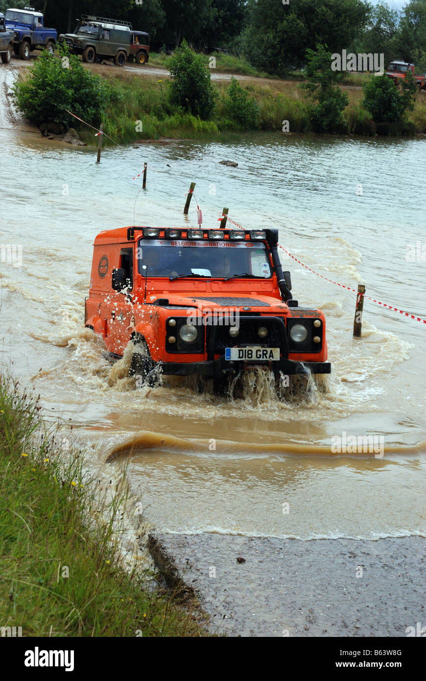 Land Rover Defender short wheelbase 90 exits the water at Billing 2008 4WD Registration number D18 GRA four wheel drive LRM Show Stock Photo