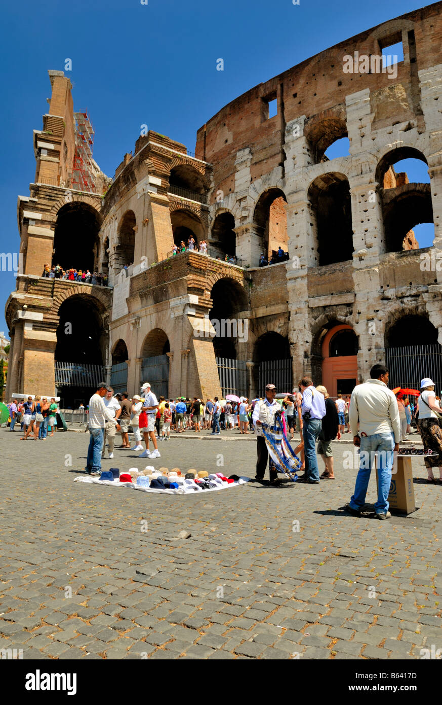 Immigrants sell fake brand goods in the street to tourists by the Colosseum, Rome, Lazio, Italy, Europe. Stock Photo