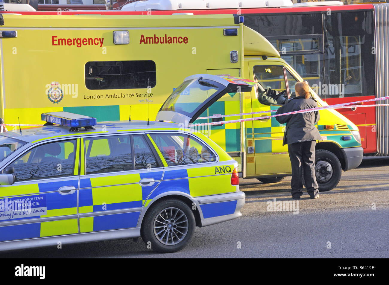 Emergency vehicles at the scene of a road traffic accident Upper Street, Angel Islington London England  UK Stock Photo
