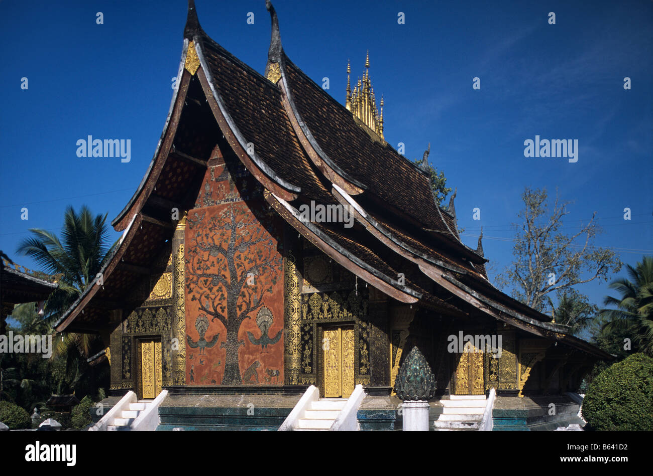 Xieng Tree The west façade with its painted-mosaic Tree of Life at Wat Xieng Thong ...