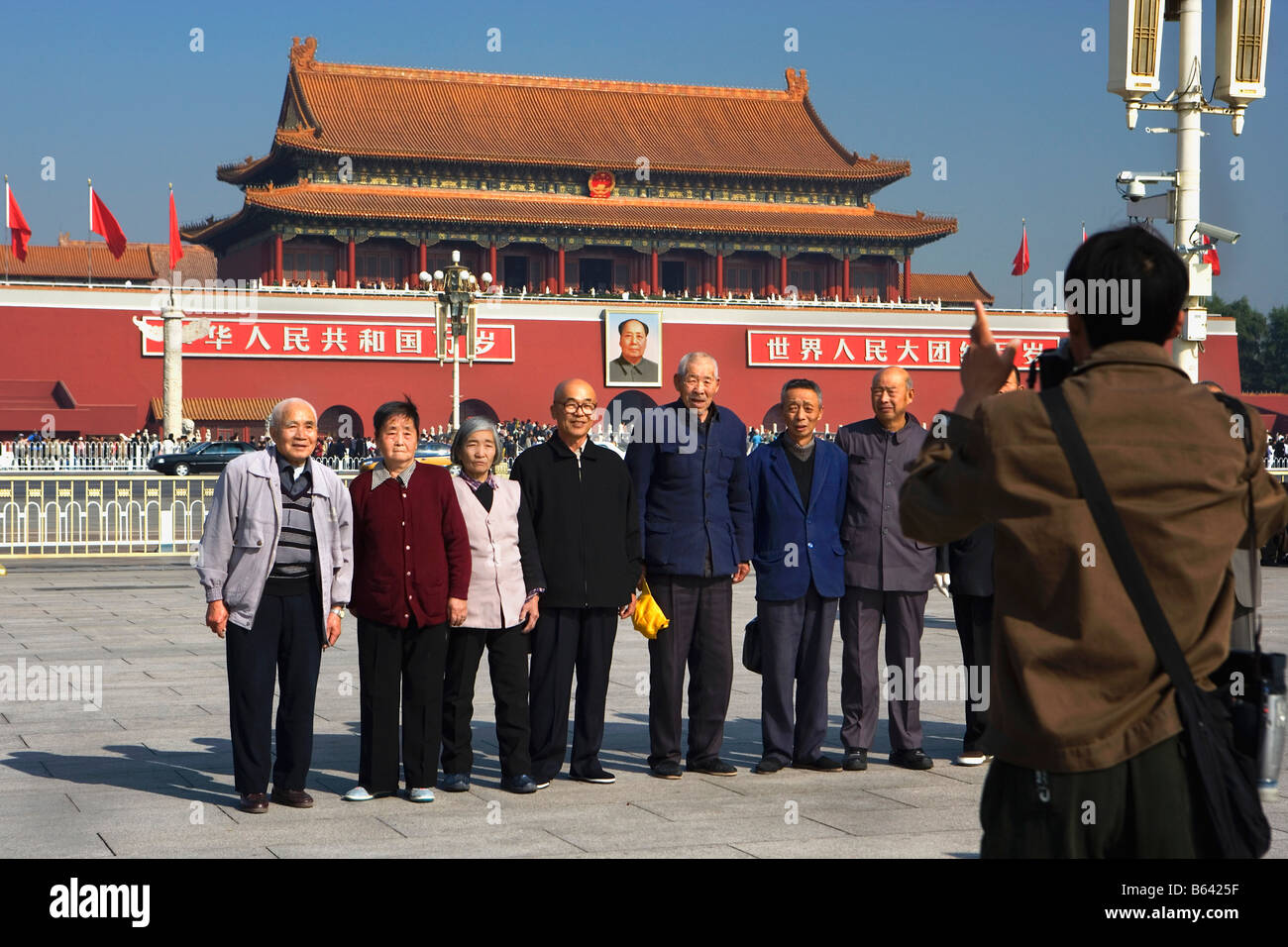 China, Beijing, View from Tien An Men ( Tiananmen ) square on Gate of Heavenly Peace with image of Chairman Mao Chinese tourists Stock Photo