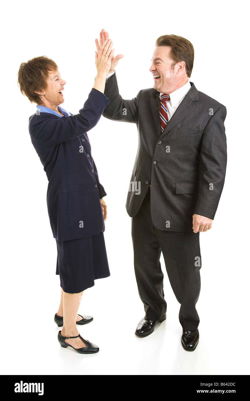 Male and female business people slapping eachother high five Full body isolated on white Stock Photo