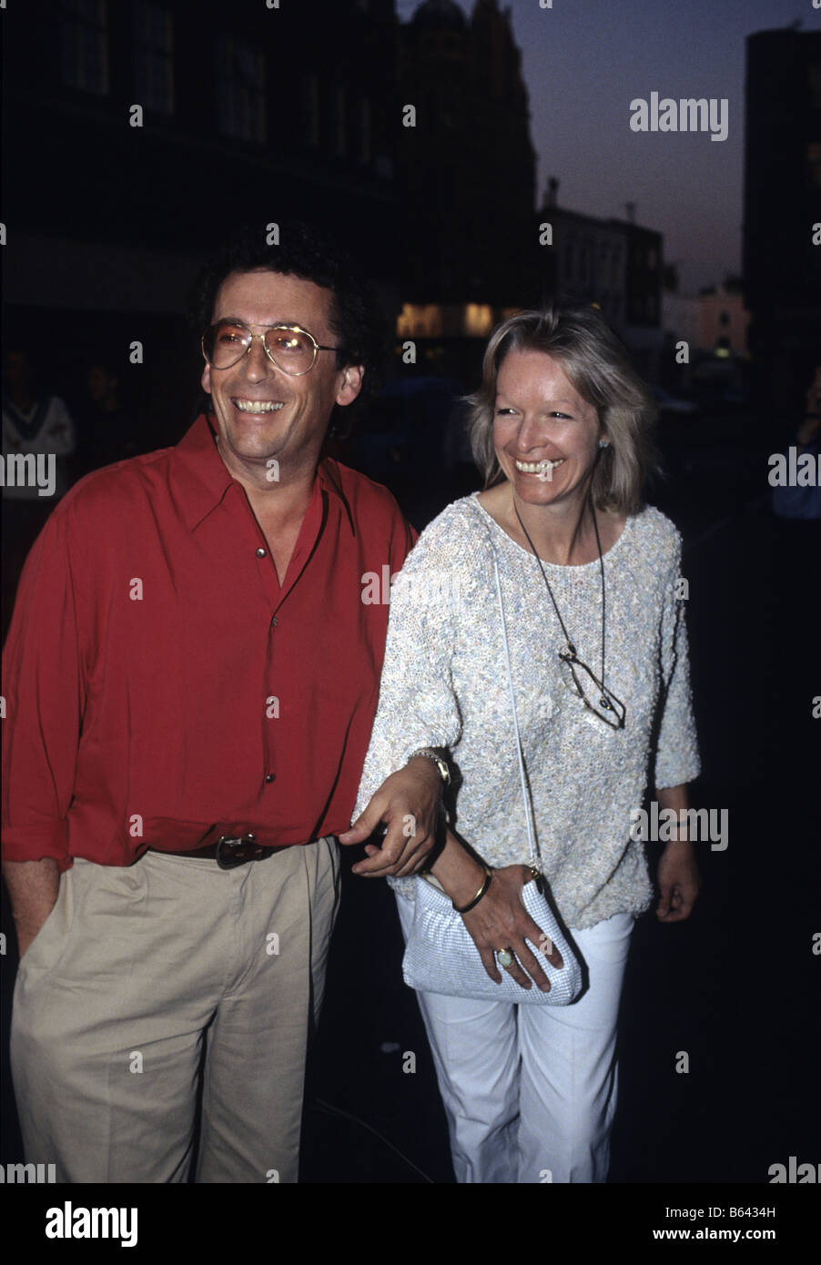 Actor Robert Powell with his wife Pans People dancer Babs Lord arriving at the opening of Sticky Fingers restaurant London Stock Photo