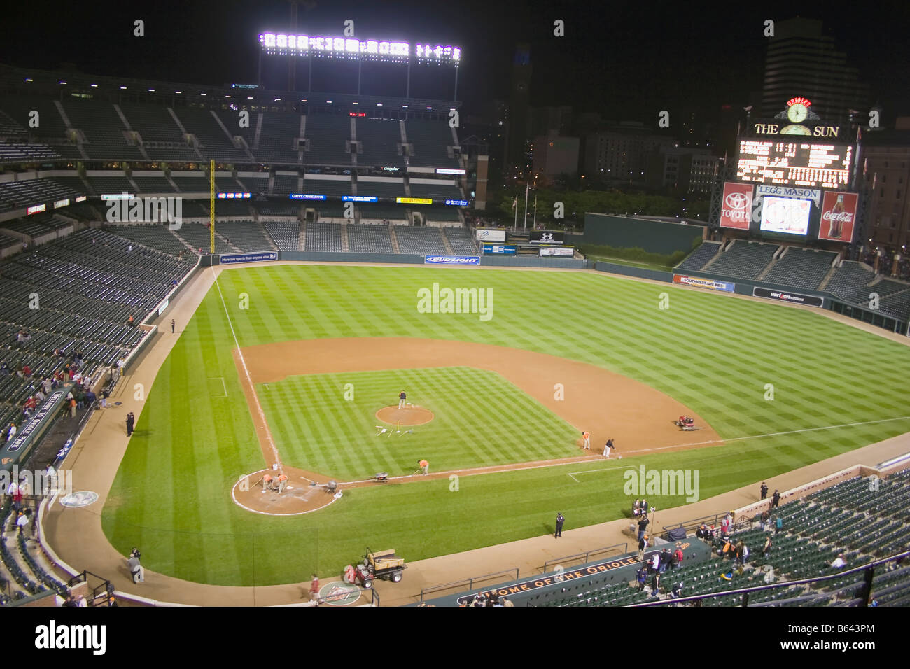 Grounds crew work on the baseball field at Camden Yards Baltimore Maryland after the Baltimore