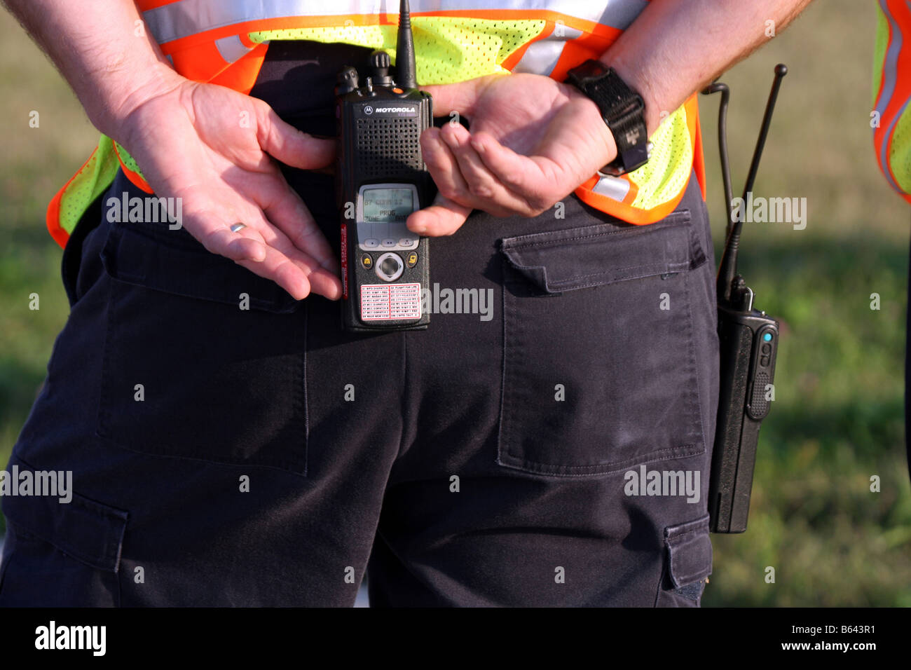 A fire department emt personnel on an emergency scene grabbing his