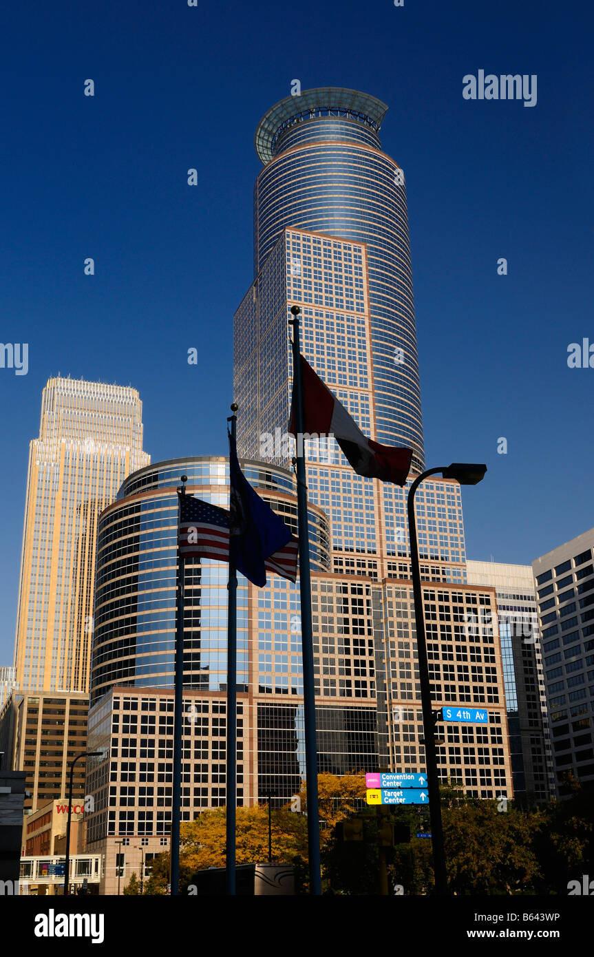 South Sixth and Wells Fargo highrise Towers with blue sky and flags in downtown Minneapolis Minnesota USA Stock Photo