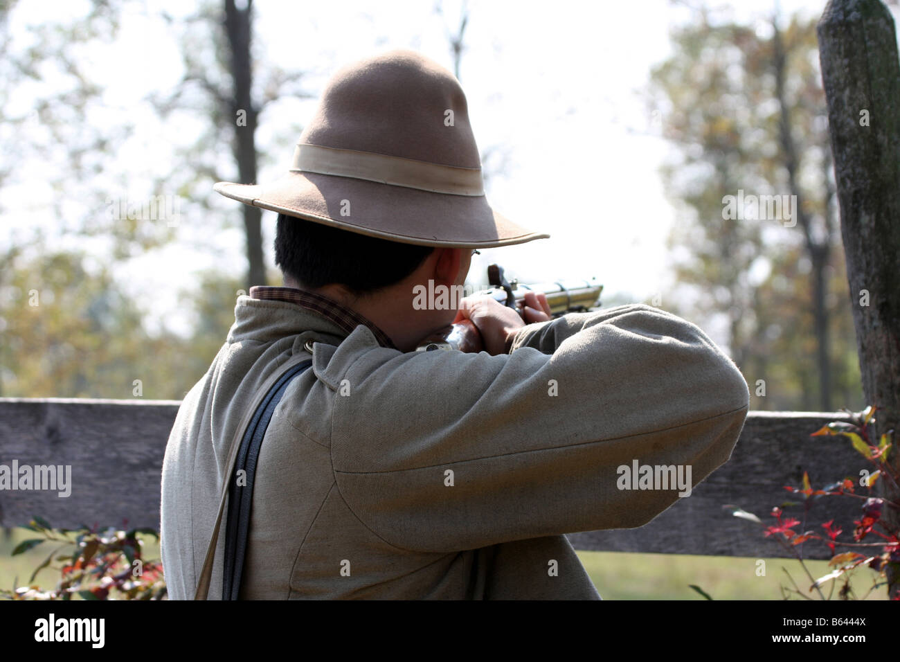 A confederate soldier hold aim at the Union soldiers at the Civil War reenactment at the Wade House Greenbush Wisconsin Stock Photo