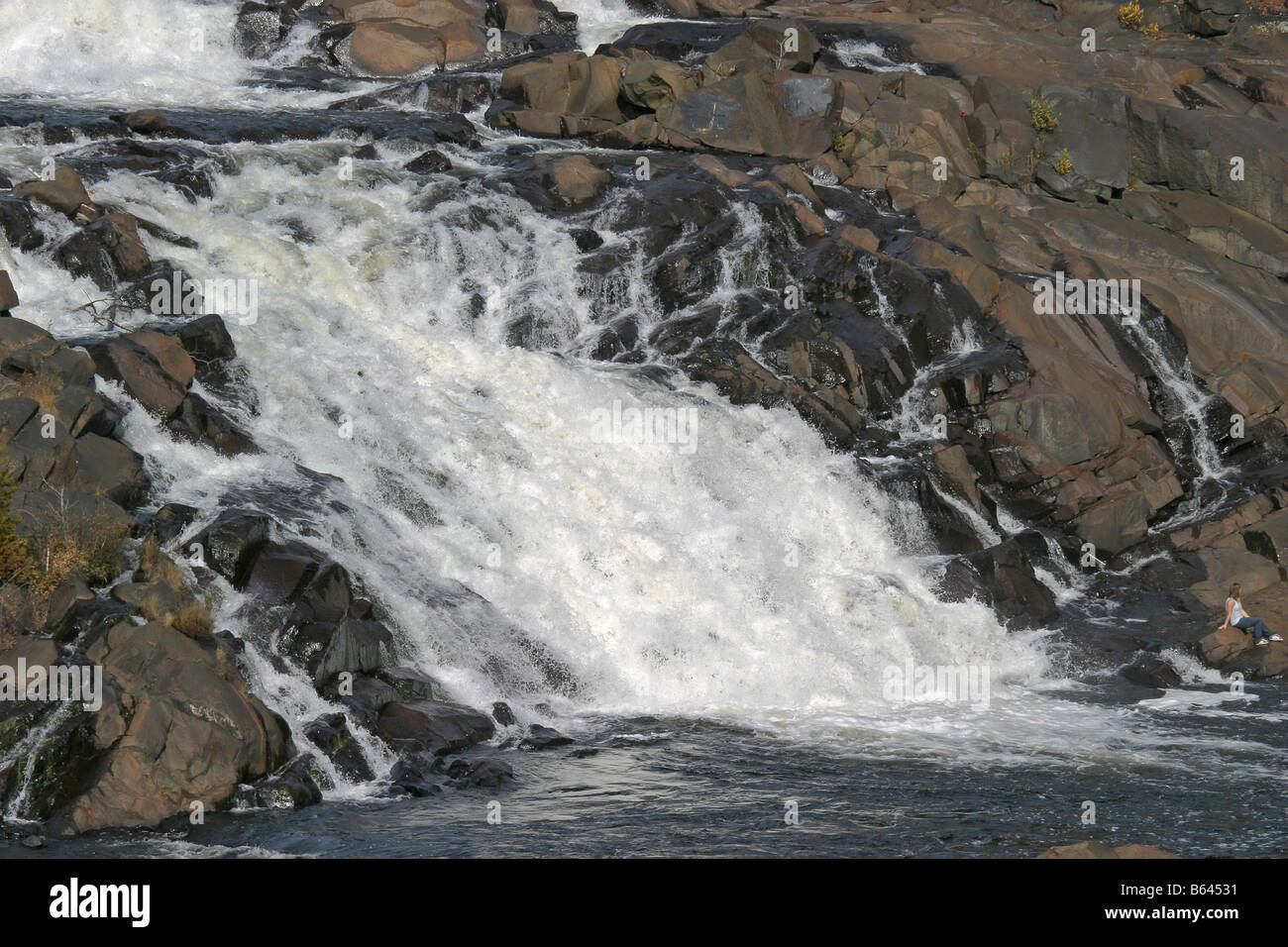 waterfall cascading down rock Stock Photo - Alamy