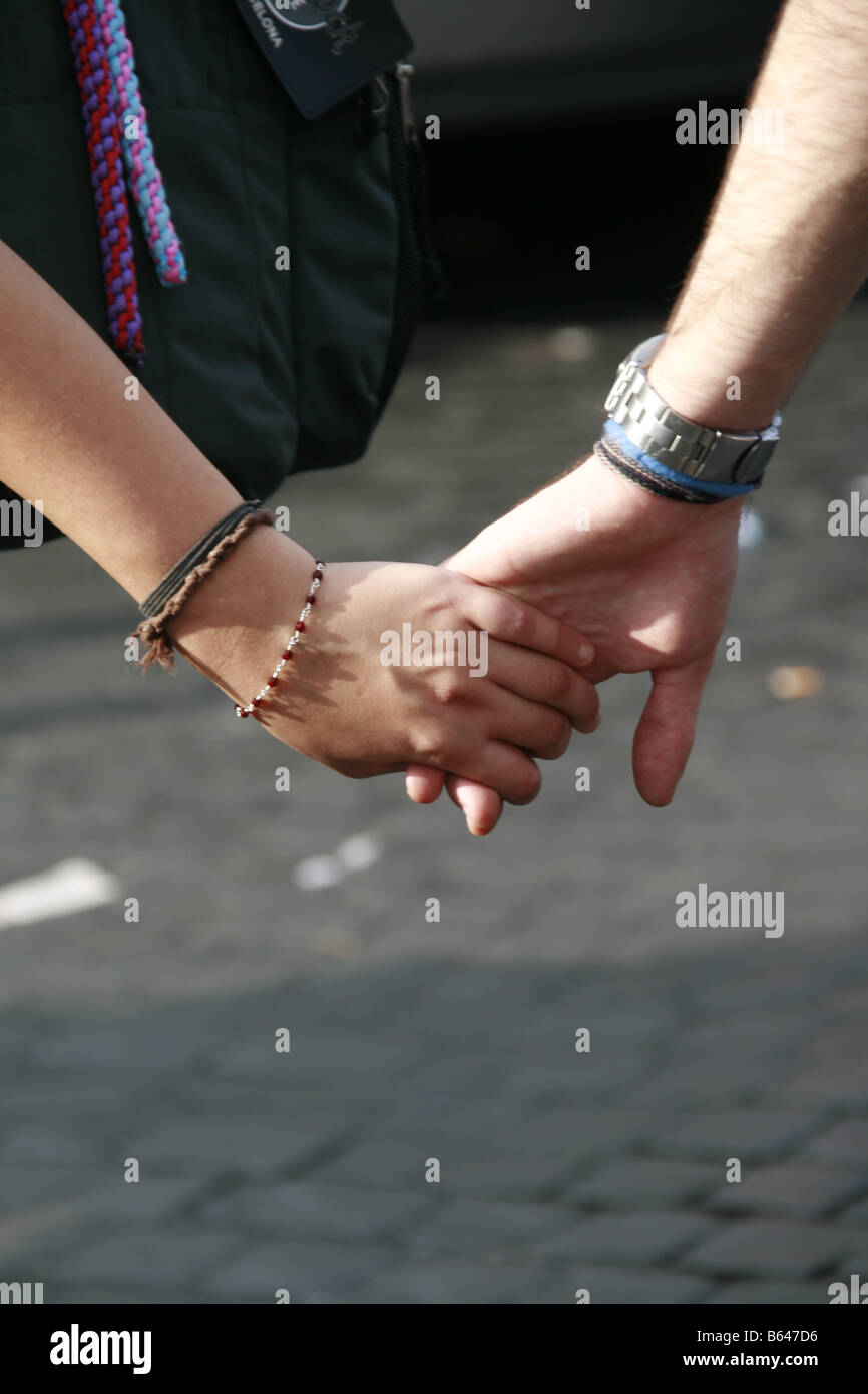 Teen couple walking holding hands hi-res stock photography and images ...
