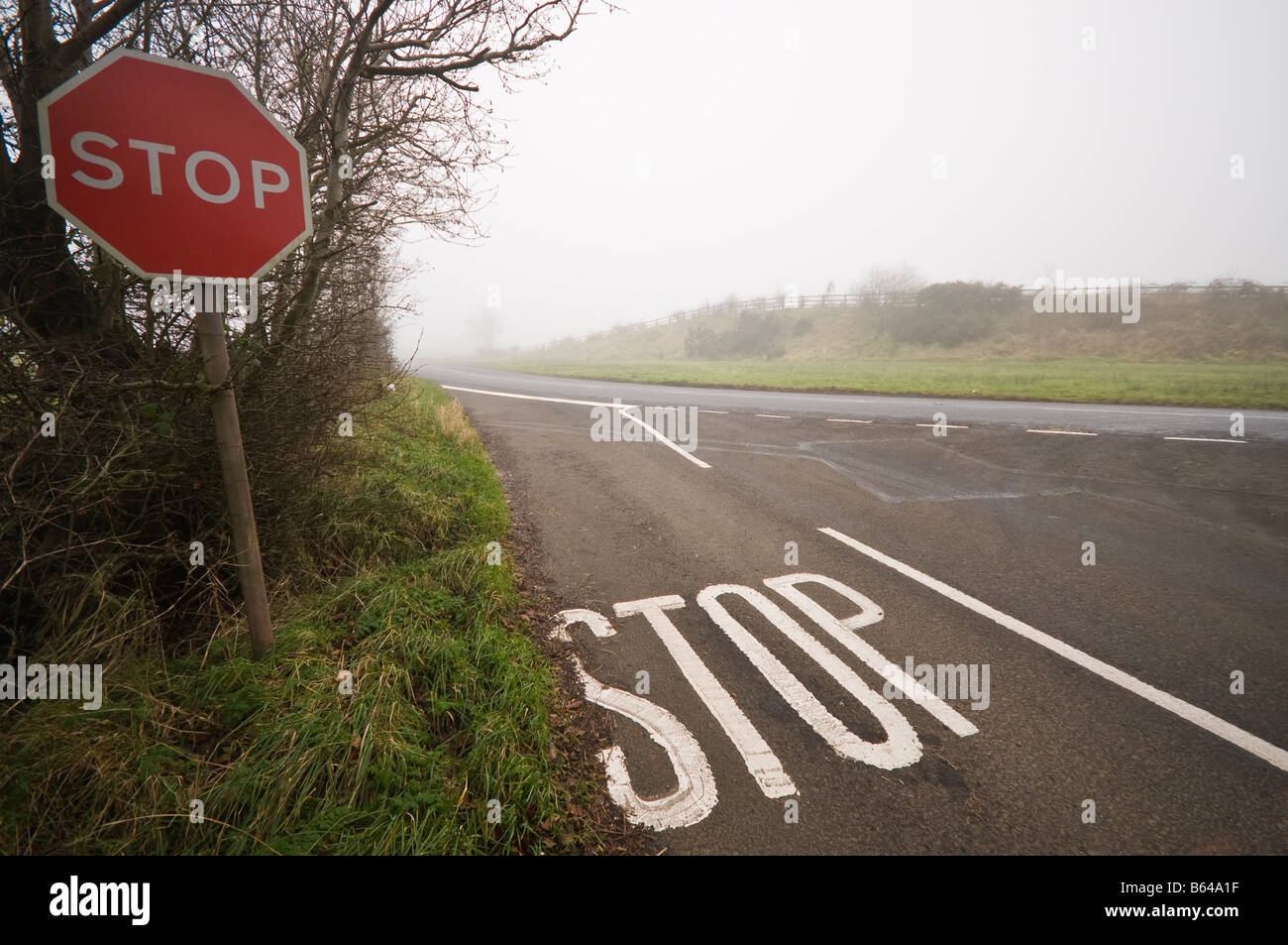 Stop sign/road marking at a junction in fog/mist/low visibility Stock Photo Alamy Stop sign/road marking at a junction in fog/mist/low visibility Stock Photo Alamy