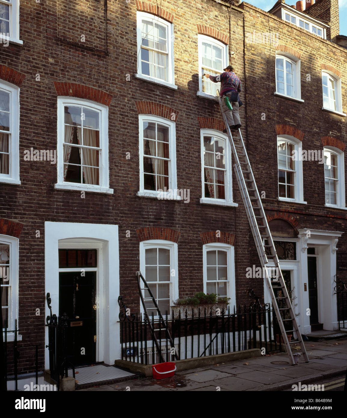 Window cleaner. Westminster, London, England, UK. Stock Photo