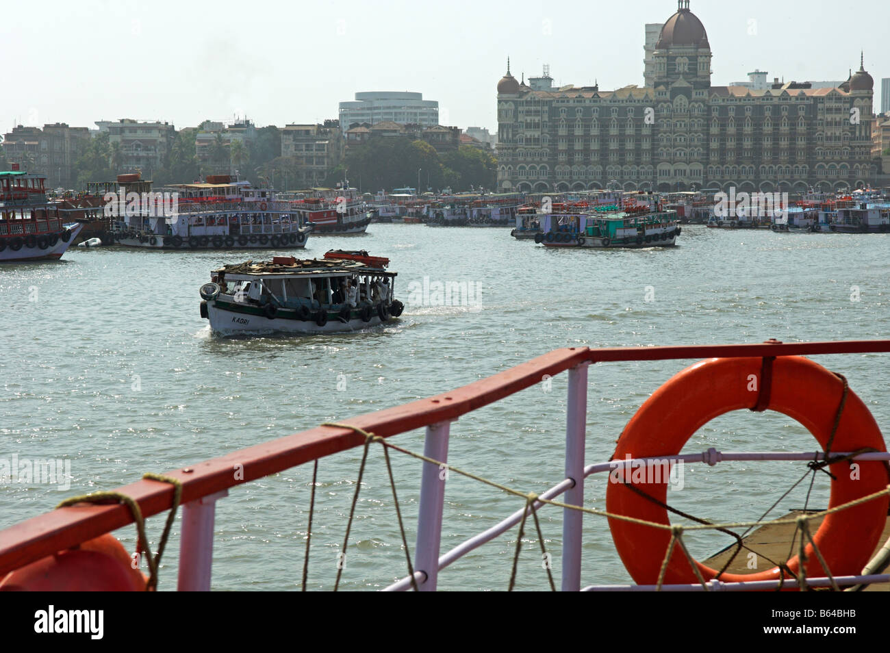 Ferry boats in Mumbai harbour with Taj Hotel in background Stock Photo