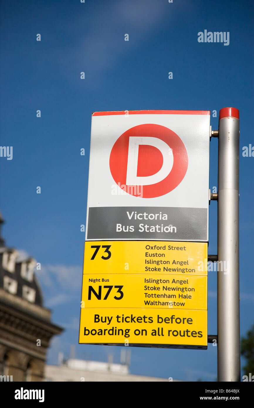 Bus stop at Victoria Station, London including route designation and