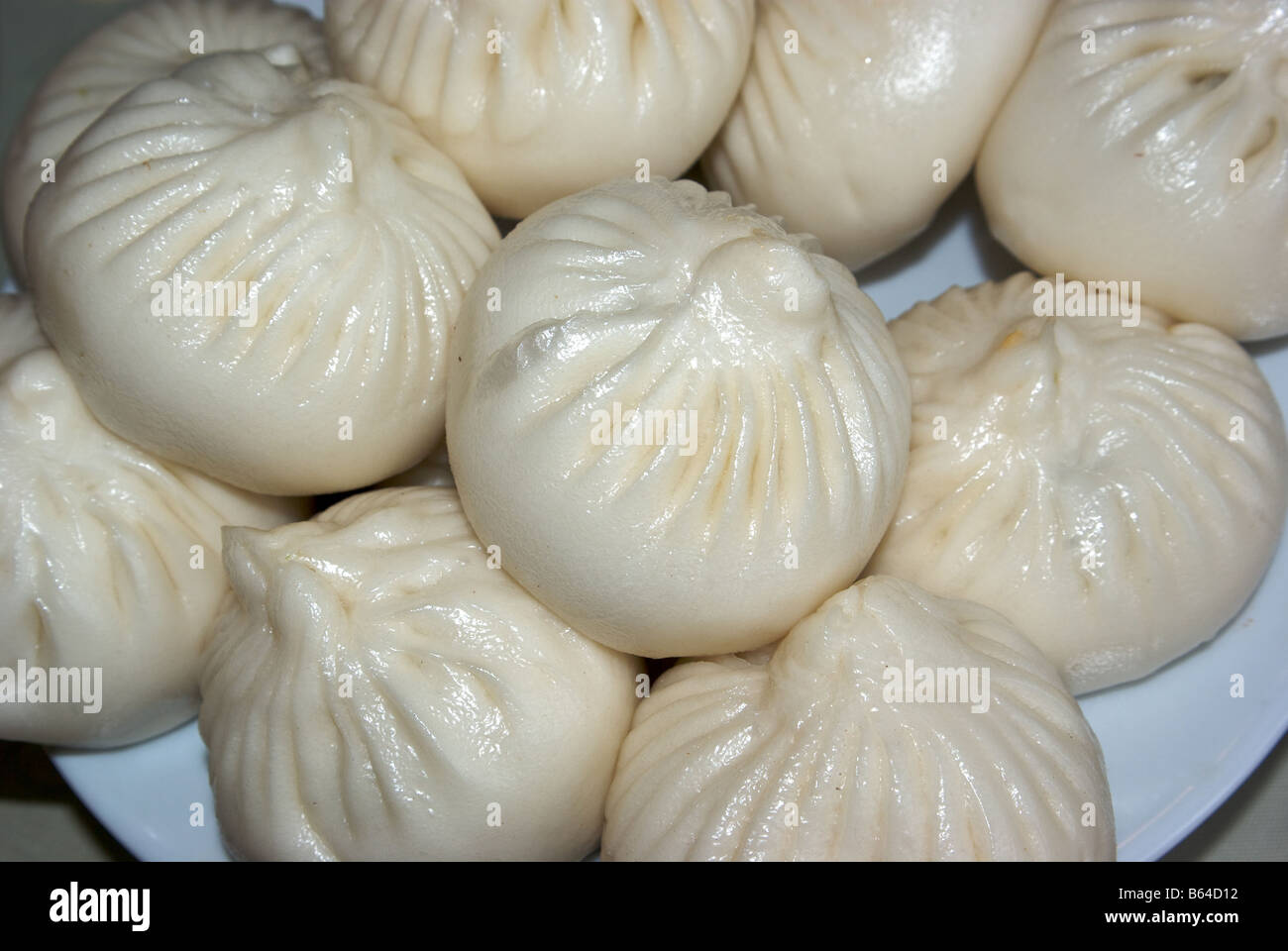 Steamed bao pork meat filled yeast raised dough dumplings dim sum lunch
