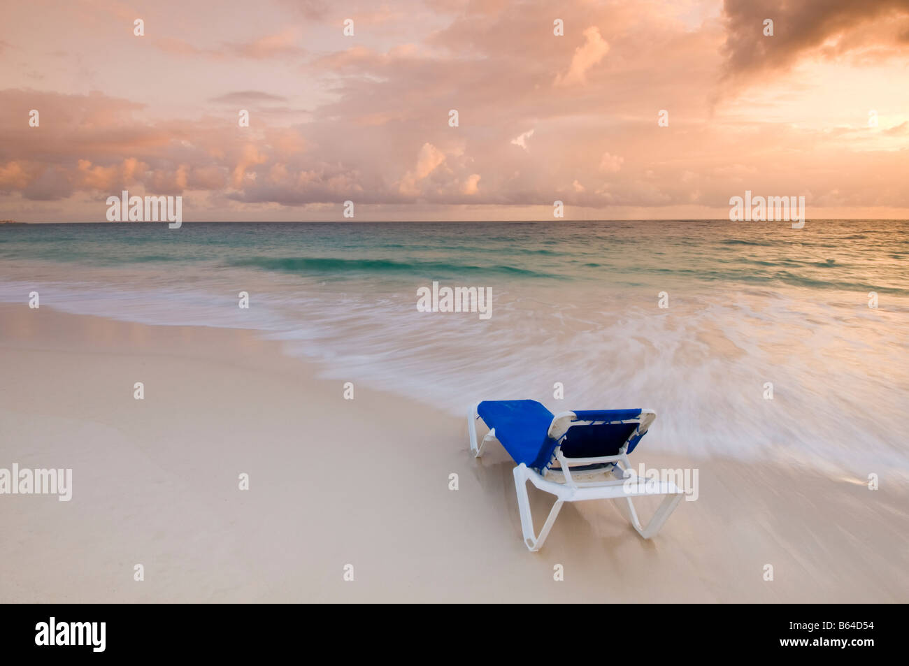Caribbean Dominican Republic Lounge chair on beach at sunrise in front