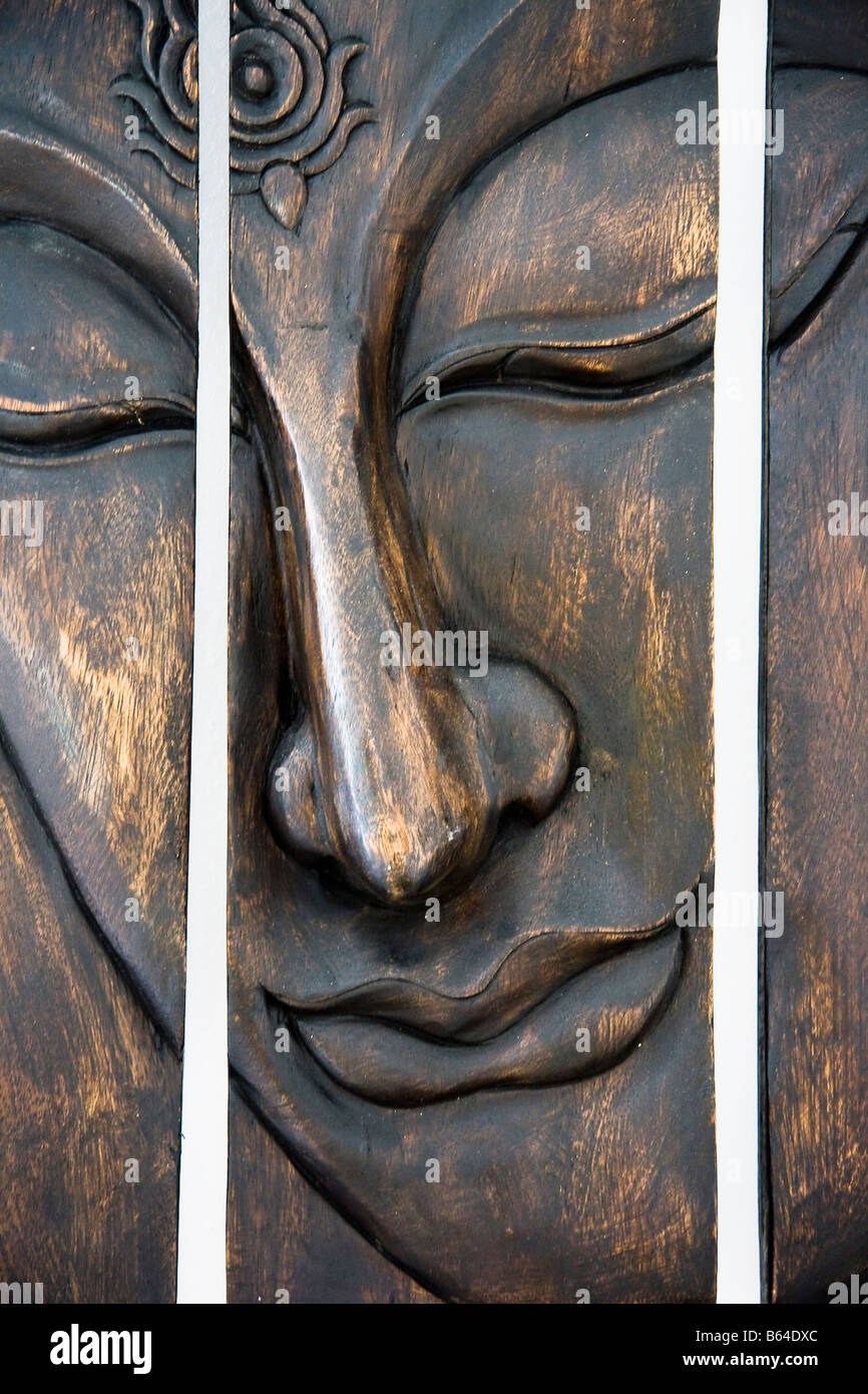 budha head wood symbol asia mango carving Stock Photo