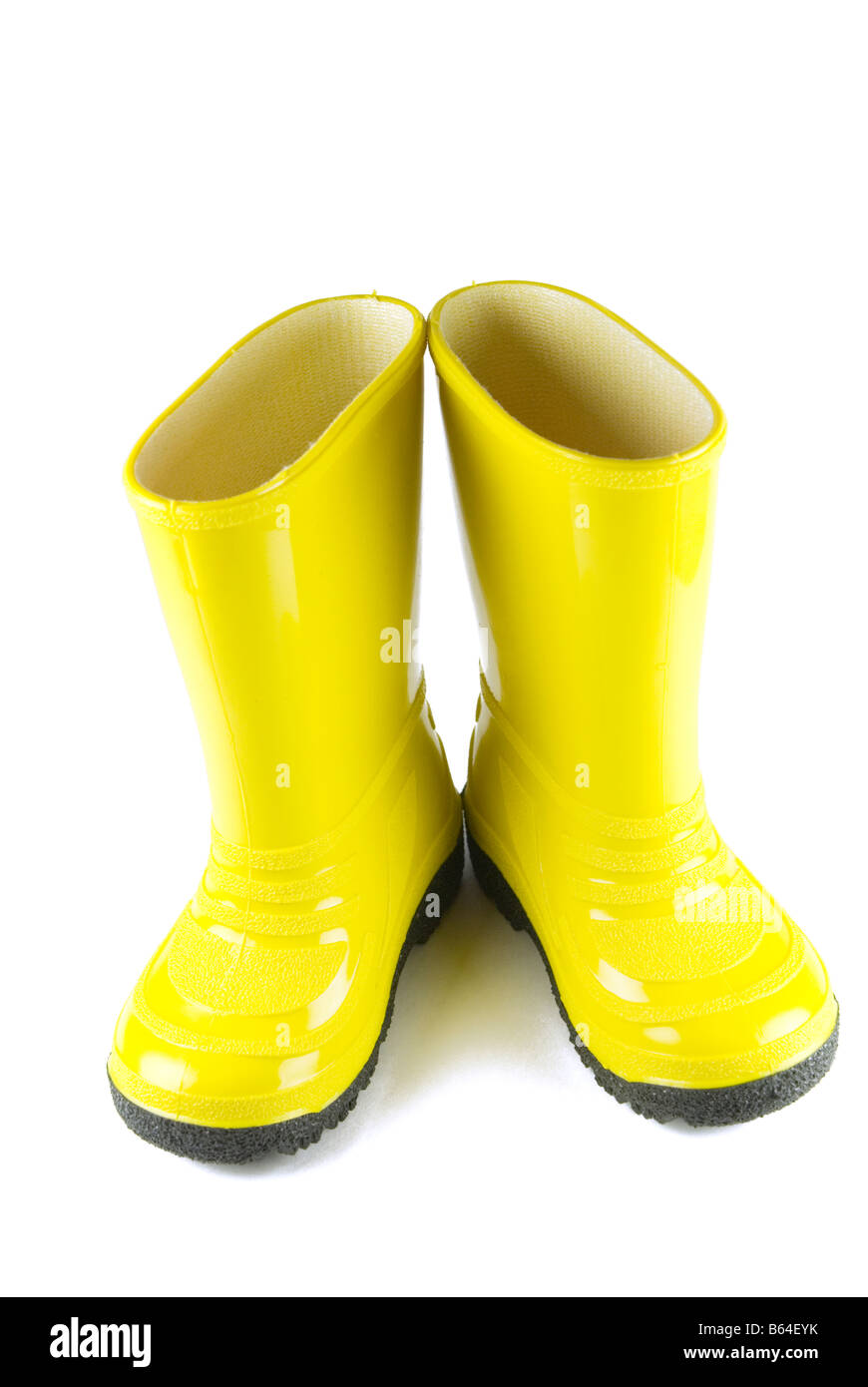 Bright yellow rain boots Stock Photo - Alamy