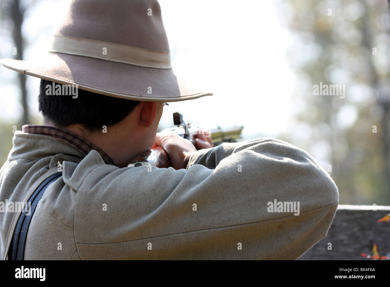 A confederate soldier hold aim at the Union soldiers at the Civil War reenactment at the Wade House Greenbush Wisconsin Stock Photo