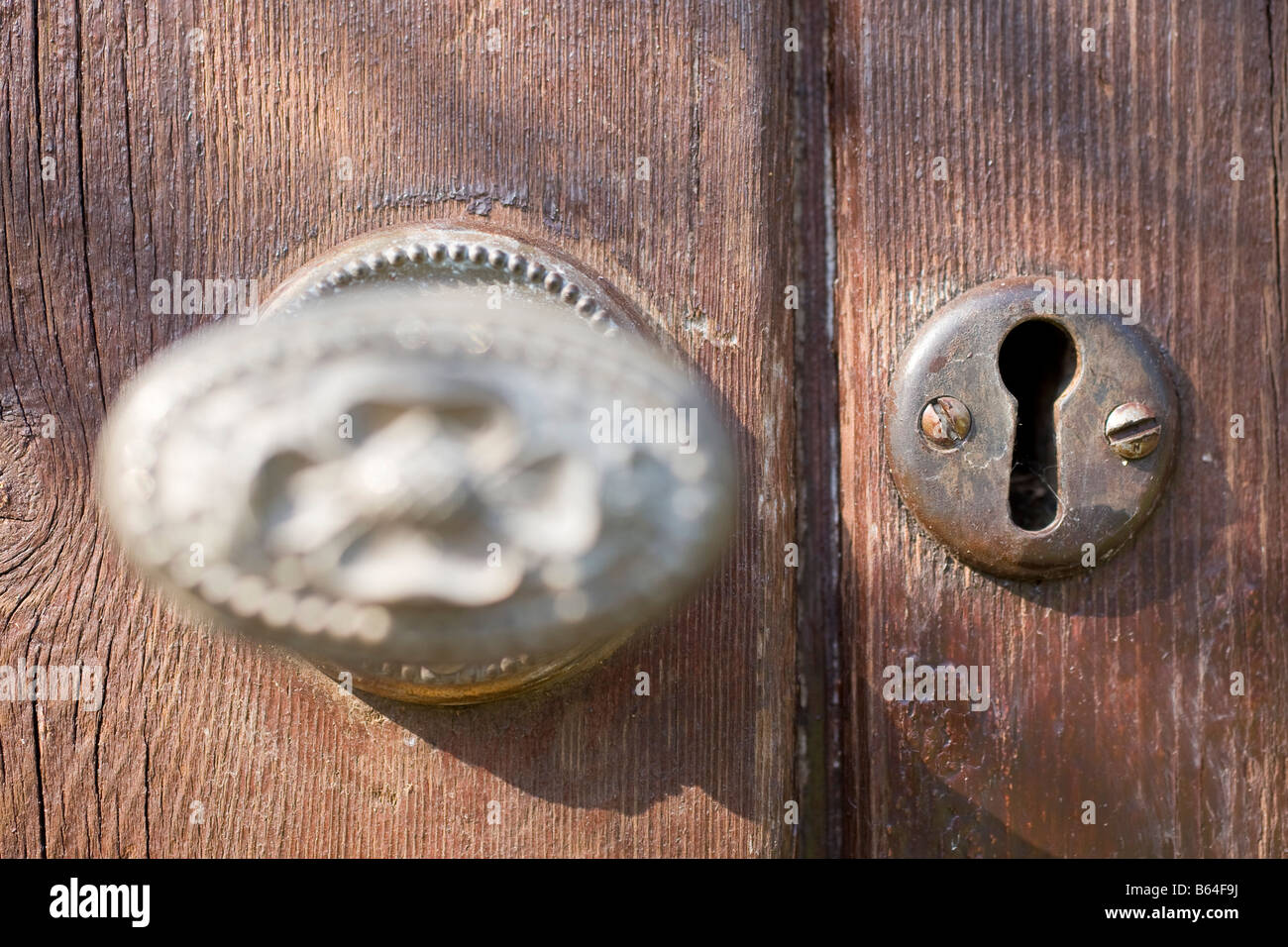 Ornate Door Handle and Keyhole in Wooden Door Stock Photo Alamy