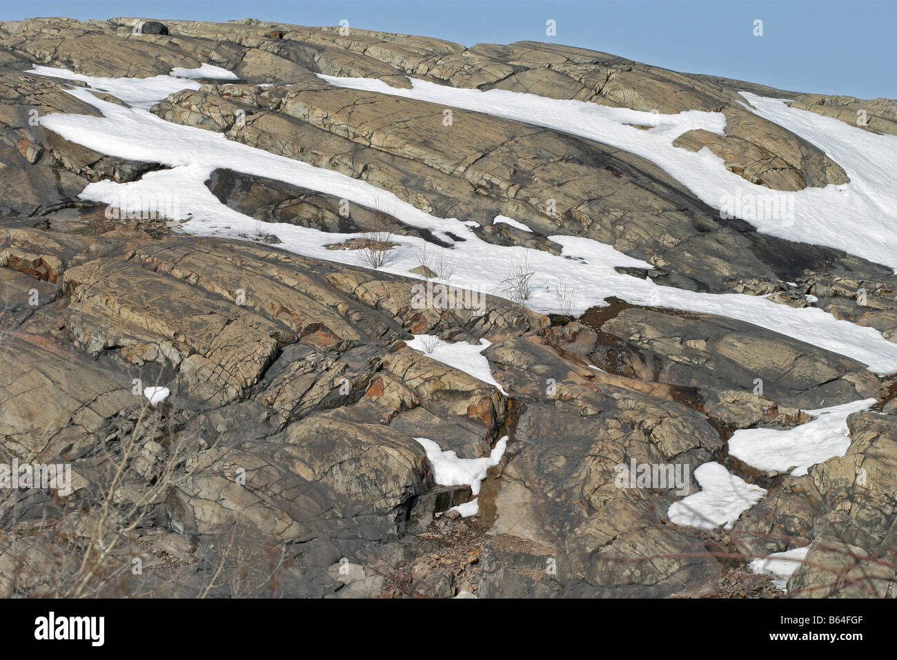 snow on rocky outcrop Stock Photo