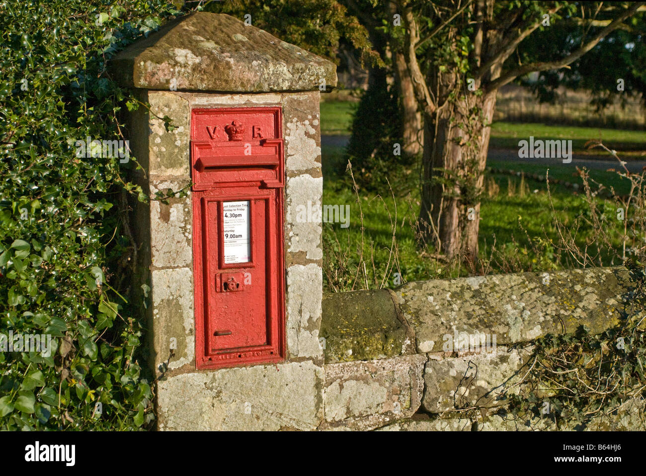 Red Victorian Letterbox in church wall in Moreton Corbet Shropshire